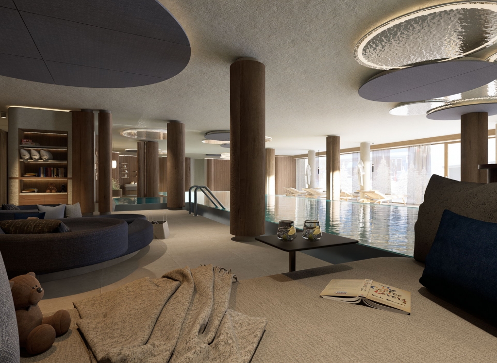 Innenansicht eines Wellnessbereichs mit Schwimmbad, Sitzgelegenheiten und Beleuchtung im Zauchenseehof. Familienhotel Zauchenseehof