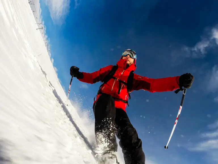 Skier performs a high speed turn on a ski slope