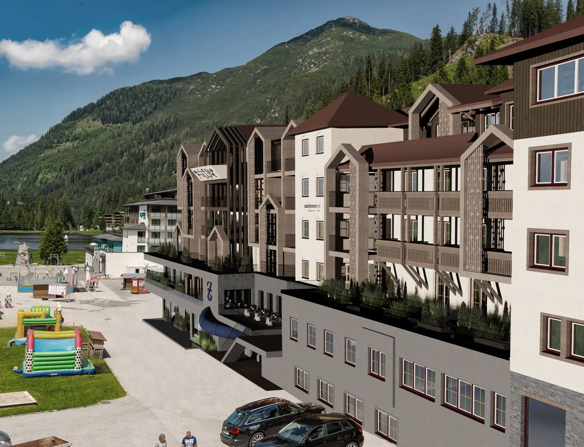 Bild der Fassade des Familienhotels Zauchenseehof mit Spielplatz davor im Sommer